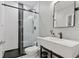Bathroom featuring subway tile, black fixtures, and a glass enclosed shower at 11025 Watermark St, Parker, CO 80134