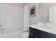 Bright bathroom featuring a tub and shower combination, stylish shower curtain, and a modern vanity with clean lines at 11025 Watermark St, Parker, CO 80134