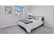 Inviting bedroom with a large window providing natural light, complemented by neutral decor and a comfortable bed at 11025 Watermark St, Parker, CO 80134