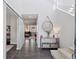 Bright entryway with hardwood floors, high ceilings, modern staircase, and decorative mirror at 11025 Watermark St, Parker, CO 80134