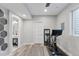 Finished room with a home gym setup including a stationary bike, mirror, and adjacent bathroom at 11025 Watermark St, Parker, CO 80134