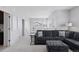 Bright living room offers a comfortable sectional sofa, ample windows with neighborhood views, and a cozy atmosphere at 11025 Watermark St, Parker, CO 80134