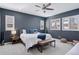 Stylish main bedroom with large windows, ceiling fan and carpet flooring at 11025 Watermark St, Parker, CO 80134