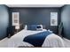 Stylish main bedroom with large windows, ceiling fan and carpet flooring at 11025 Watermark St, Parker, CO 80134