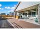 The backyard patio is perfect for entertaining with a bar and plenty of seating at 26310 E 3Rd Pl, Aurora, CO 80018