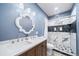 Modern bathroom with double sink vanity and stylish walk-in shower at 26310 E 3Rd Pl, Aurora, CO 80018