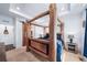 Bedroom with log frame bed and sliding barn door at 26310 E 3Rd Pl, Aurora, CO 80018