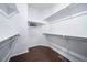 Walk-in closet with wood floors and storage racks at 26310 E 3Rd Pl, Aurora, CO 80018