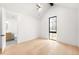 Bright bedroom with vaulted ceiling and large window offers an ensuite bathroom with contemporary finishes at 1823 W 35Th Ave, Denver, CO 80211