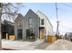 Modern two-story home with gray brick and white siding and updated curb appeal at 1823 W 35Th Ave, Denver, CO 80211