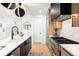 Modern kitchen with stainless appliances, white countertops and dark wood cabinets at 1823 W 35Th Ave, Denver, CO 80211