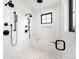 This shower includes dual shower heads, a built-in bench and hand rails, plus a window to let in natural light at 1823 W 35Th Ave, Denver, CO 80211