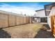 Spacious backyard with a modern pergola, wood fence, and manicured landscaping at 1518 S Columbine St, Denver, CO 80210