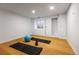 Basement exercise room with hardwood floors and natural light at 1518 S Columbine St, Denver, CO 80210