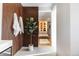 Bathroom featuring modern vanity, stylish wood accent wall, and a glimpse into the well-organized closet at 1518 S Columbine St, Denver, CO 80210