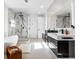 Elegant bathroom with marble walk-in shower, soaking tub, dual sink vanity with modern black hardware at 1518 S Columbine St, Denver, CO 80210