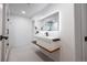 Bright bathroom boasts modern fixtures, sleek vanity, and minimalist design with an illuminated mirror at 1518 S Columbine St, Denver, CO 80210