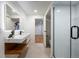 Bright bathroom with floating vanity, modern lighting, and view to bedroom at 1518 S Columbine St, Denver, CO 80210