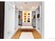 Spacious walk-in closet with custom shelving, drawers, lighting, and a plush bench at 1518 S Columbine St, Denver, CO 80210