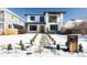 Stunning two-story home with modern design and snowy front yard at 1518 S Columbine St, Denver, CO 80210