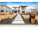 Stunning modern home with walkway, minimalist landscaping and mailbox in a lovely suburban neighborhood at 1518 S Columbine St, Denver, CO 80210