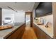 Modern kitchen with dark cabinetry, marble countertops, and a built-in oven at 1518 S Columbine St, Denver, CO 80210