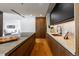 Modern kitchen with dark cabinetry, marble countertops, and a built-in oven at 1518 S Columbine St, Denver, CO 80210