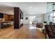 Open concept living area with hardwood floors and modern fireplace at 1518 S Columbine St, Denver, CO 80210