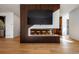 Living room with a TV mounted above a linear fireplace and barstool seating at 1518 S Columbine St, Denver, CO 80210