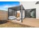 Outdoor patio area features modern pergola, stylish seating, and wood deck at 1518 S Columbine St, Denver, CO 80210