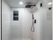 Sleek, modern shower with frameless glass enclosure and rainfall shower head at 1518 S Columbine St, Denver, CO 80210