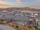 Aerial view of a home with fenced yard, surrounded by a well-developed neighborhood with mountain views at 6514 Agave Ave, Castle Rock, CO 80108