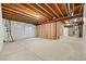 Unfinished basement featuring exposed beams, a concrete floor, framed walls and rough-in mechanicals at 6514 Agave Ave, Castle Rock, CO 80108