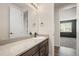 Bathroom vanity featuring granite countertops and dark wood cabinets at 6514 Agave Ave, Castle Rock, CO 80108