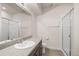 Bathroom featuring a granite countertop, a glass shower, and ample space for a luxurious feel at 6514 Agave Ave, Castle Rock, CO 80108
