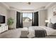 Comfortable bedroom with a tray ceiling, large windows and a cozy carpet at 6514 Agave Ave, Castle Rock, CO 80108