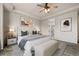 Bright bedroom with neutral tones, a ceiling fan, and an en-suite bathroom at 6514 Agave Ave, Castle Rock, CO 80108