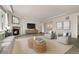 Inviting living room featuring a fireplace, elegant decor, and ample space for entertaining guests at 6514 Agave Ave, Castle Rock, CO 80108