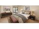 Comfortable bedroom features modern furniture and a large window with a view at 800 N Pearl St # 702, Denver, CO 80203