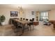 Bright dining room boasts modern lighting, fireplace, and a view to the balcony at 800 N Pearl St # 702, Denver, CO 80203
