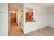 Hallway featuring wood trim, tile flooring and a pass-through to the kitchen with granite countertops at 800 N Pearl St # 702, Denver, CO 80203