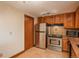 Cozy kitchen has stainless steel appliances, wooden cabinets, and lovely countertops at 800 N Pearl St # 702, Denver, CO 80203