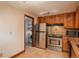 Bright kitchen features stainless appliances and leads to the laundry room at 800 N Pearl St # 702, Denver, CO 80203