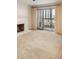 Spacious living room with carpet, fireplace and a balcony at 800 N Pearl St # 702, Denver, CO 80203