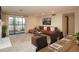 Open living space with modern furniture, fireplace, and a view from the balcony at 800 N Pearl St # 702, Denver, CO 80203