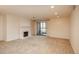 Spacious living room with a fireplace and sliding glass doors to a balcony at 800 N Pearl St # 702, Denver, CO 80203