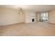 Spacious living room featuring carpet, fireplace, and balcony access with natural lighting at 800 N Pearl St # 702, Denver, CO 80203