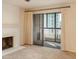 Bright living room with fireplace, balcony and sliding glass doors at 800 N Pearl St # 702, Denver, CO 80203
