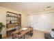 Well-lit office space featuring a rustic desk, shelving, and ample storage at 800 N Pearl St # 702, Denver, CO 80203