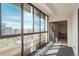 Well-lit sun room featuring sliding glass doors leading to the exterior balcony and neutral finishes at 800 N Pearl St # 702, Denver, CO 80203
